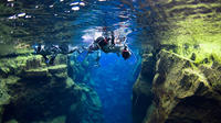 Snorkelling at Silfra in Crystal Clear Water between Two Tectonic Plates