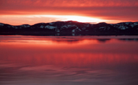 Vol en hélicoptère au coucher du soleil