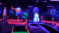 Prague Black Light Mini Golf and Games Tour Including Free Drinks