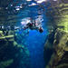 Snorkelling at Silfra in Crystal Clear Water between Two Tectonic Plates