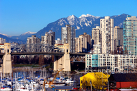 Vancouver City Tour Including Capilano Suspension Bridge
Your half-day Vancouver city tour starts with pickup in the late morning from your downtown Vancouver hotel. Aboard a comfortable coach, travel through Vancouver to Canada Place, Robson Street and Stanley Park, where you’ll stop to view the renowned totem poles. After crossing the historic Lions Gate Bridge and passing Cleveland Bridge – offering great views of Capilano Lake – make your way to the famous Capilano Suspension Bridge. You’ll enjoy bird’s-eye views of the spectacular canyon and thriving coastal forest as you cross the 450-foot-long (137-meter) bridge. If you’re feeling extra adventurous, do the Cliffwalk, which takes you on a thrilling journey by foot along a series of suspended walkways jutting out from the granite cliff face above the Capilano River! You’ll also have time at this attraction to browse the shops and enjoy lunch (own expense). Afterward, continue your coach tour to Granville Island for time to explore the public market, marinas, eateries and galleries. Your next highlights are Chinatown – the 2nd-largest in North America – and the historic Gastown district. Throughout your tour, your knowledgeable guide will offer commentary about the sites you see. Your tour concludes with hotel drop-off. Vancouver City Tour Including Capilano Suspension Bridge