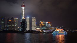 Photo of Pudong and Boat A view of Pudong, along with a boat simliar to one we were on for the cruise , Melissa H - June 2012