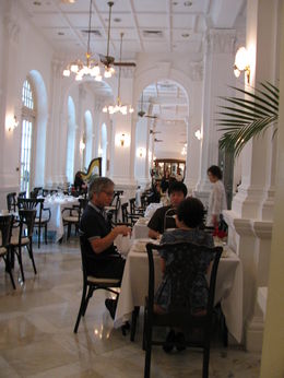 Photo of Taking Tiffin at Raffles, photo shot from our private dining area, delightf From far end of the Tiffin Room with buffet in distance, note harpist half way down on left. , Debora D - January 2014