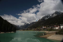Photo of The Ride to Cortina We stopped at a small dam with a spectacular view of the mountains and reservoir with a village alongside. , Stanton M - June 2016