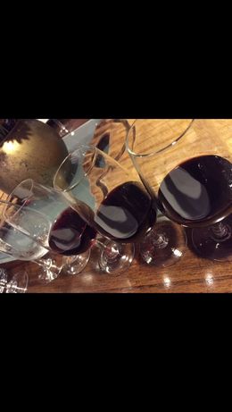 Photo of 3 of the 5 wines Tasting the last three wines the first 2 were white. Food pairings were amazing! , Victoria N - May 2016