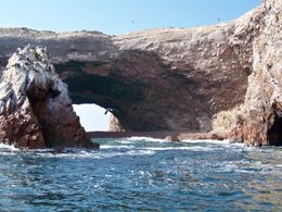 Photo of Nazca Lines Air Tour and Ballestas Islands Day-Trip Guano-covered rock forms arches over the deep blue sea at Ballesta Islands, Tim Leffel - August 2011