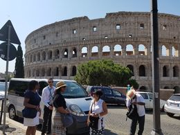 Photo of With our driver, Fabrizio, in front of Coluseum. Our driver, provided by Viator, is giving us instructions on how to use our skp the line tickets. , Victor S - July 2016