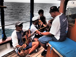 Photo of Entertainment Here's some of the entertainment on the ride out. One guy in the back has a couple of spoons. It's great! , Monica M - July 2014
