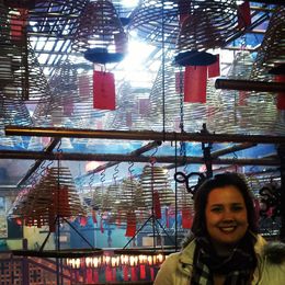 Photo of Man Mo Temple Hundreds of coiled incense hangs from the roof, burning. The daily logistics is baffling, and the smoke gets in your eyes :P , Amy-Claire - March 2014