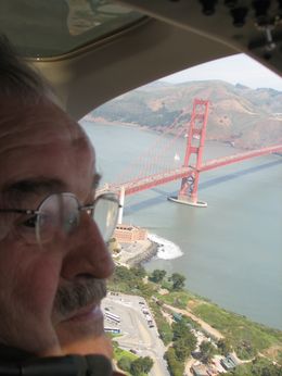 Photo of Dad & Golden Gate Bridge My Dad was seating as the co-pilot and had a first class view of the Golden Gate Bridge! - August 2009