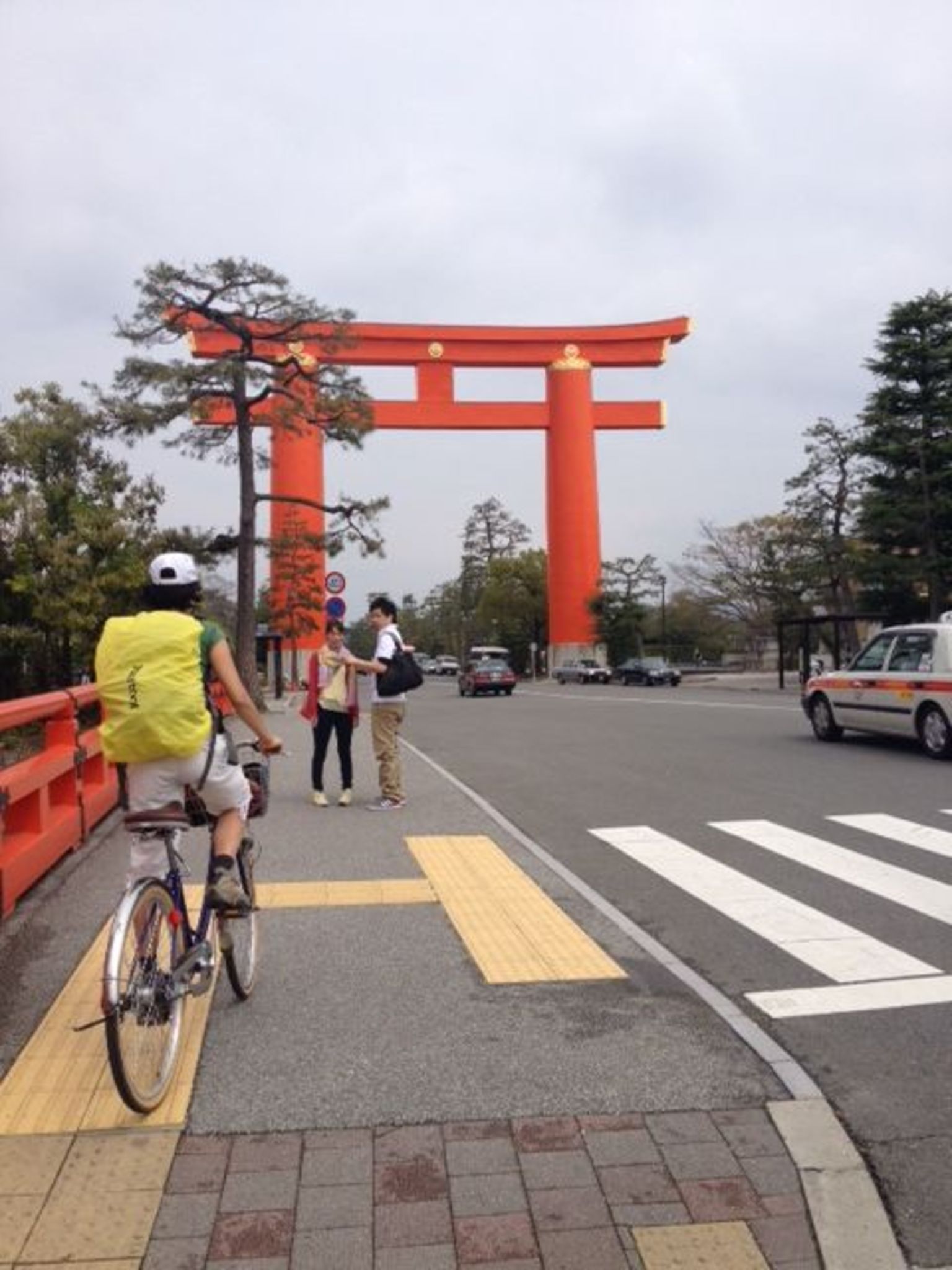 Biking towards the gate of Heian Jingu Shrine