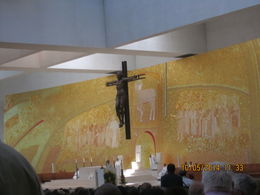 Photo of Ultra modern church at Fatima Church service taking place Saturday 11 May before festival on 13 May. The picture behind the alter is made of gold leaf and designed by a German guy , Patsi Ann - May 2014