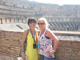 Photo of P1070916 Our guide Emanuella (in yellow) and Trish my beautiful wife! Colosseum in the background. , pooley - June 2012