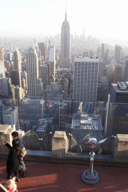 Photo of Top of the Rock We skipped the line with our Explorer Pass. Saved us about 25 minutes. This is a picture of the Empire State Building from the observation deck. Photos are a bit hazy from the pollution. , Laurie - May 2013