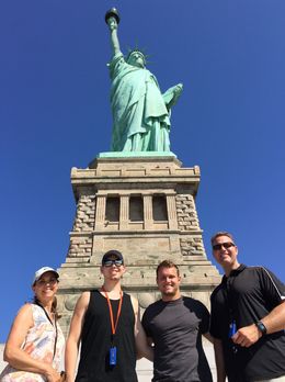 Photo of Happy NYC Tourists with Lady Liberty. Great shot of our visit to the Statue of Liberty. Thanks Sal! , Thomas M - July 2016