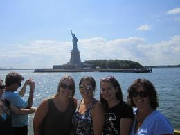 Photo of Beautiful day on the water taxi! What a thrill to see the Statue of Liberty up close--our tour guide was nice enough to take a picture of me and my daughters! , Sue G - July 2012