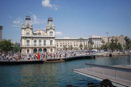 Photo of Port Vell and La Barceloneta The port is almost a city unto itself. This is a view from on the pier that was moving while everyone was on it in order to let a ship pass. As you stroll along the pier's promenade you'll see ... , Theresanne S - July 2009