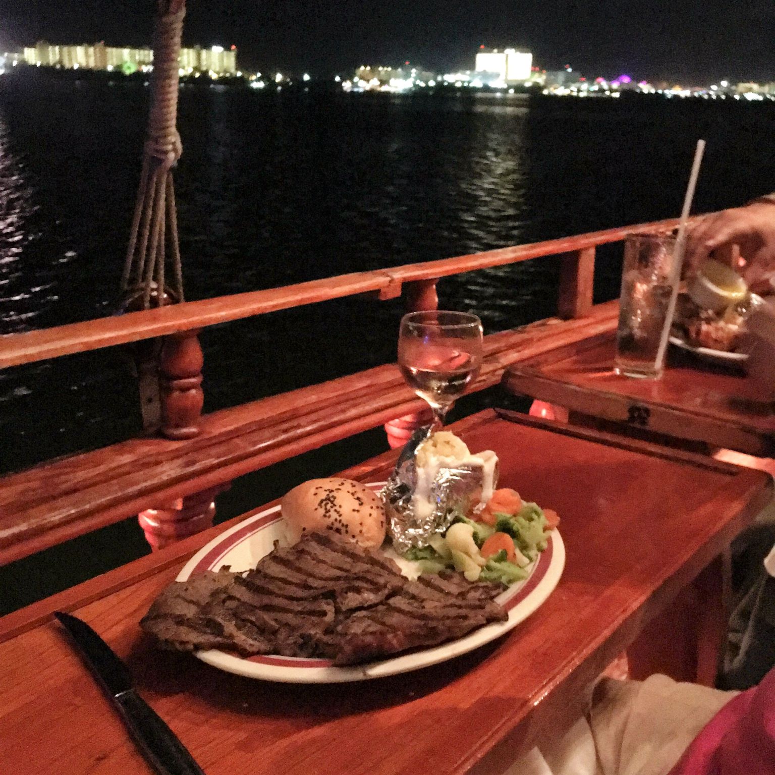 Steak and Lobster Dinner with a splash of Wine