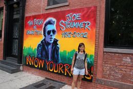 Photo of Joe Strummer This is me, very happy next to the painting of Joe Strummer from The Clash , Valeria P - October 2015