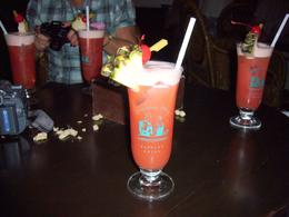 Photo of The Long Bar at Raffles Hotel The Singapore Sling in the Long Bar. It didn't last long..., Roger R - February 2009