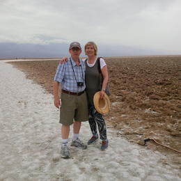 Photo of Death Valley in the Summer….a perfect cloudy day and a walk onto the flats! Tom and Paulina Brecher standing on the salt flats of Death Valley. A remarkable experience. , Paulina B - August 2014