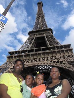Photo of Eiffel Tower with the Kids One of the reasons that standing atop the Eiffel Tower feels unique is that the structure is open to the wind, making it seem that one is not actually inside a building. What architectural ... , Keith N - August 2009