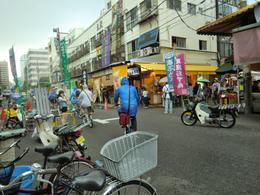 Photo of Food Street in Tsujiki Market Rain dampened the market but not the tour! With or ponchos equipped we head on to our next destination! , Flora W - June 2014