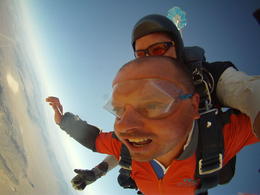 Photo of Extreme skydiving at 15000ft Smiling already having just jumped out of the plane with my instructor, Brian, , Paul C - June 2013