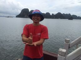 Photo of My tour guide on the boat Halong Bay Cuong my tour guide at Halong Bay with a NQ Cowboys supporters cap Australian NRL premiers 2015 , Jennifer L - October 2015
