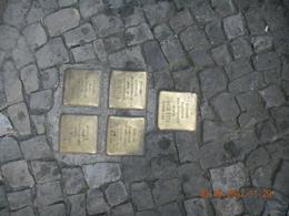 Photo of Streets Memorial On every street in the old jewish quarter you can see this tiny "memorial plates" in betwen the stone pieces of the walkways. Each one is dedicated to a person killed at an extermination ... , Leon - September 2012