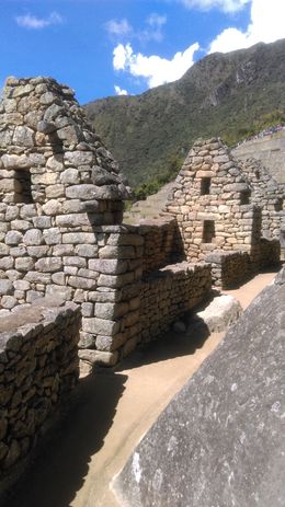 Photo of Up close with the mysteries of Machu Picchu In some areas you can walk into the buildings of Machu Picchu but those who oversee this site are slowly roping off more and more areas since the site is deteriorating from the thousands of tourists ... , Heather H - May 2016
