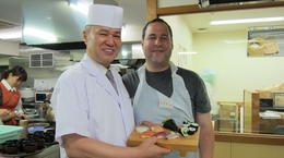 Photo of My husband with the sushi he made and the chef/teacher My husband with the sushi he made and the chef/teacher , Corinne B - October 2013