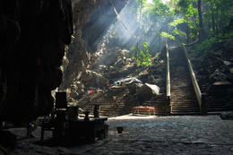 Photo of Perfume Pagoda Sun beams shine through smoke caused by burning incense in the Perfume Pagoda. The site in North Vietnam is the country's most holy Buddist place. - November 2011