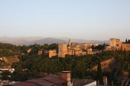 Photo of Alhambra at sunset as seen from the mirador St. Nicolas Don't miss the Mirador St. Nicolas on the hill opposite the Alhambra for a fun atmosphere, great crafts and spectacular views. , mkeren - July 2015