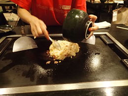 Photo of Our tour guide made Okonomiyaki savory Japanese pancakes at the table Our tour guide made Okonomiyaki savory Japanese pancakes at the table. Delicious! , Ginger A - July 2015
