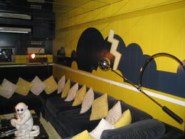 Photo of Elvis Presley's entertainment center in the basement of Graceland Elvis' logo in yellow and blue (lightning bolt through blue clouds : TCB (Taking Care of Business) , Wayne B - November 2013