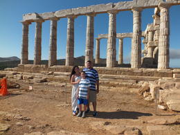 Photo of In front of the Temple of Poseidon (Sounion afternoon) My family in from of the Temple, looking out on the sea , Nicole D - July 2014