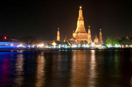 Photo of Wat Arun from Chao Phraya River On Chao phraya River: Wat Arun (Temple of the Dawn) Illuminated in the evening in Bangkok, Thailand - June 2011