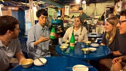 Photo of Sun teaching us about Makgeolli We found ourselves in what I could best describe as a 'tent pub', playing games and eating great food. Thank you Sun! , samanthas_postbox - August 2016