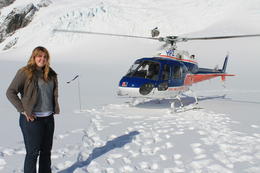 Photo of Caitlin on Fox Glacier My daughter Caitlin standing on Fox Glacier in front of our helicopter. , MARY E - May 2013