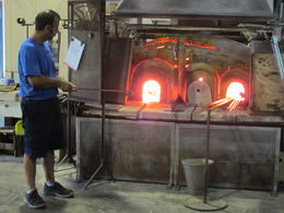 Photo of Heating the glass Artist working on the glass piece reheating it in the oven. , Jose - September 2016