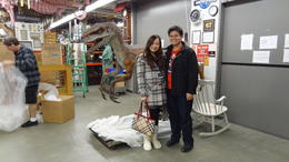 Photo of Props Warehouse We get to visit a props warehouse and see lots of interesting props used in the movies! Here's a picture of my boyfriend and I with the Baby T-rex in Jurassic Park! , jasminetay - February 2013