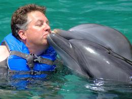 Photo of Dolphin jealousy? After giving Misty a kiss Pepe wanted his share of love from Jay at Dolphin Cove. - July 2008