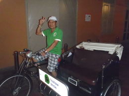 Photo of Travelling by Trishaw Singapore This was our lovely driver who transported us so expertly through the very busy traffic in Singapore during our 'Singapore's Chinatown Trishaw Night Tour' , john q - January 2016