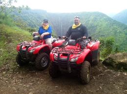 Photo of Big Island ATV tour through Waipio Vally in November 2013 This is one of those AMAZING locations that you get to see on this tour and there are so many that we got to see. This is the sacred King's Valley and behind us is a beautiful long waterfall that ... , Nicole R - December 2013