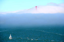 Photo of Foggy Frisco The top of the Golden Gate Bridge is just peeping through the fog on a beautiful San Francisco day. A yacht sails past Alcatraz Island in the foreground. , Peter Whitten - March 2011