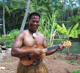 Photo of Ukelele player, Polynesian Cultural Center One of the villagers plays a Ukelele, Polynesian Cultural Center, Margaret G - September 2009