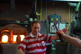 Photo of Shaped Glass Completed A master glass shaper displays his finished work, a rearing stallion. , John P - June 2011