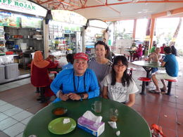 Photo of At Maxell hawker center with our wonderful guide This is the second hawker center we visited in this tour after visiting the city planning office building where we learned about a little bit of Singapore's history and city planning. , Kaz - September 2015