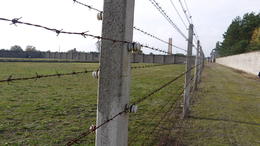 Photo of The Wire This photo does not require much explanation. The ominous site of an electrified fence is a touch of reality of what this place was about. , David W - November 2013